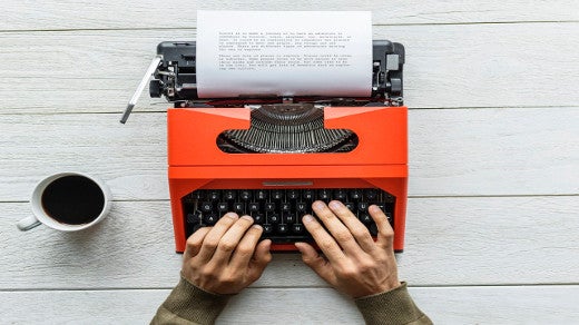 Typewriter with hands